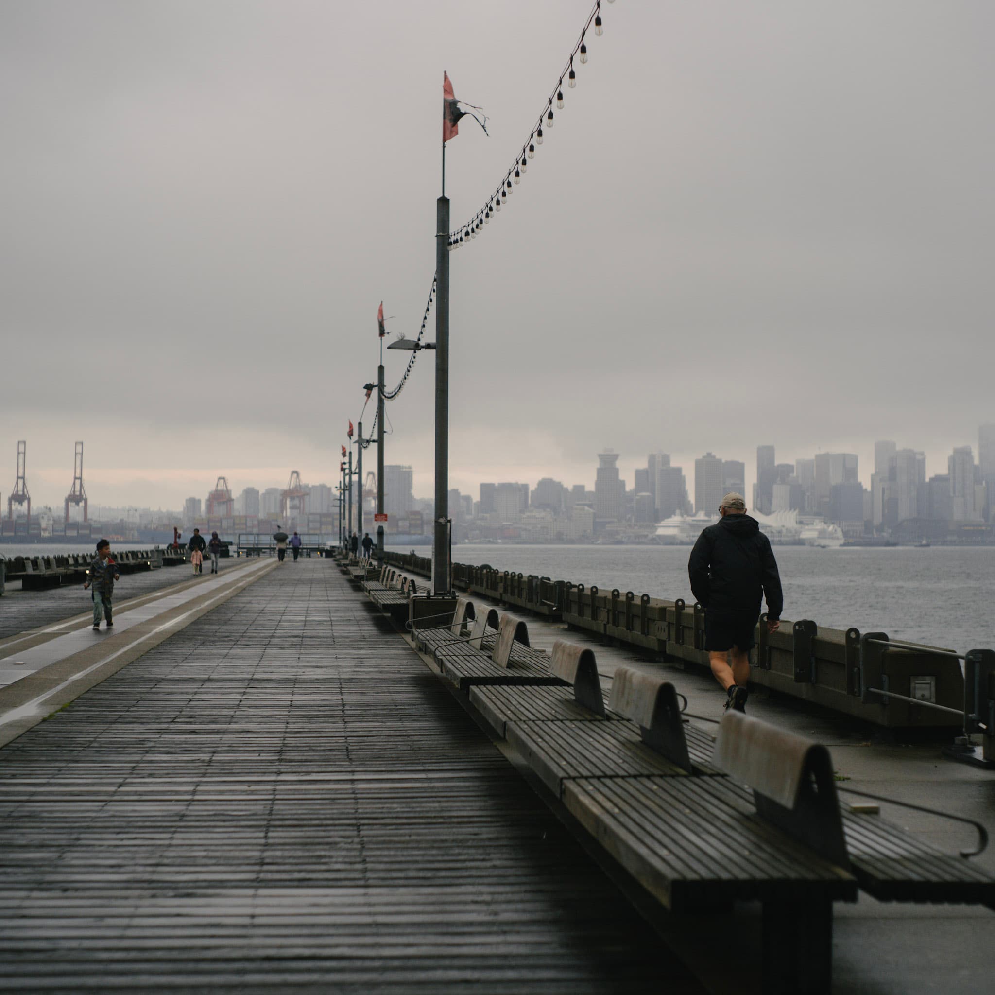 A photo of a Gloomy Vancouver downtown across the Burrard Inlet